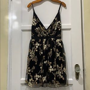 Black dress with gold and off white flowers